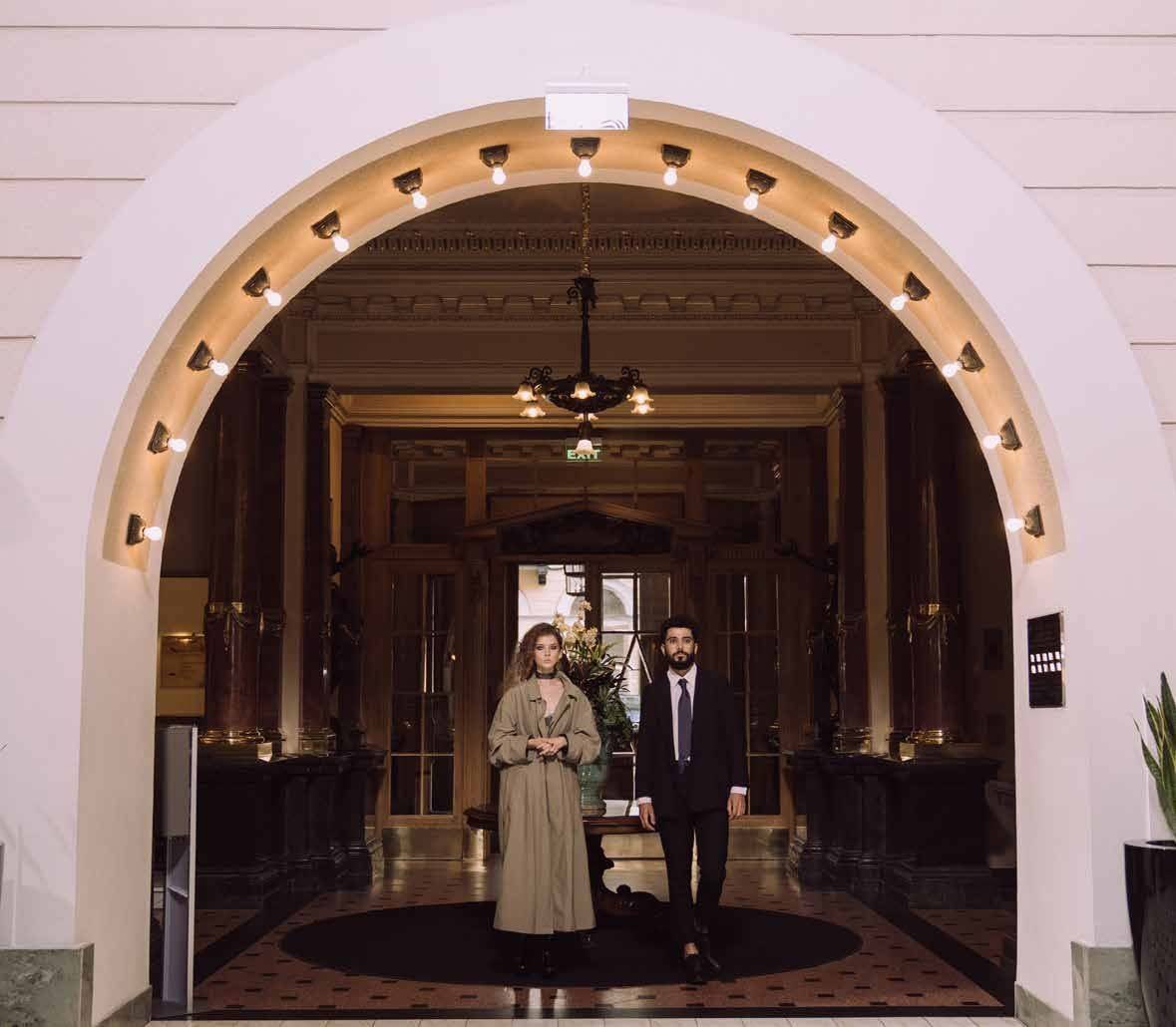 Hotel lobby beneath a lit archway